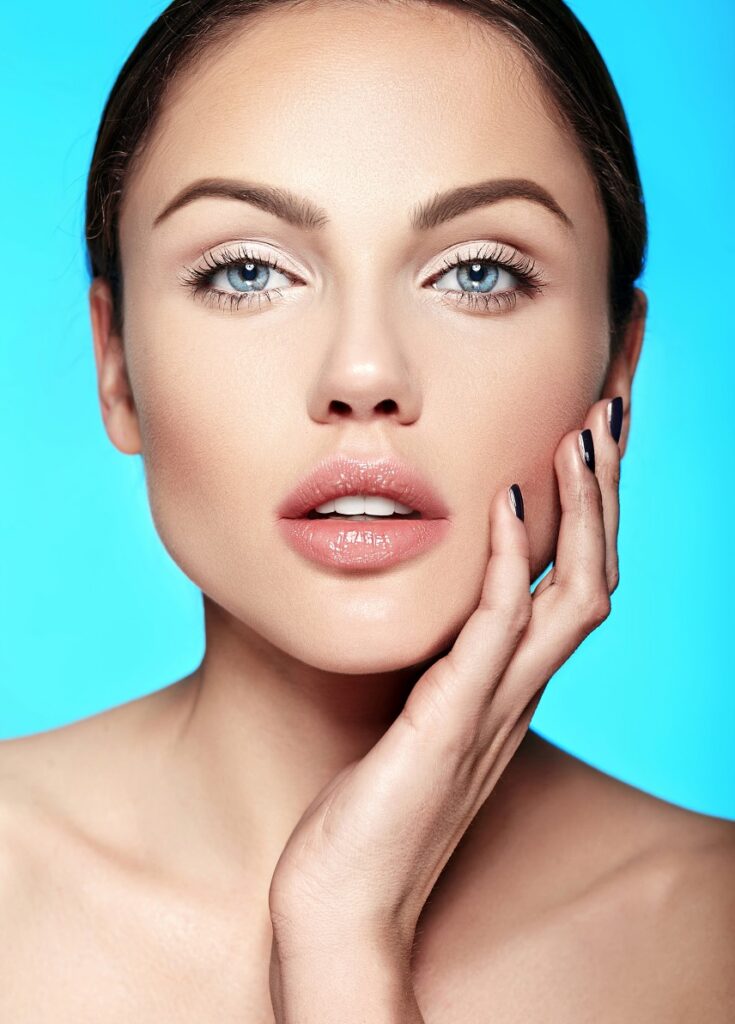 Studio shot of a woman's face and her natural-looking, full lips after having lip filler near Schaumburg at Chicago Aesthetic Surgery Institute.